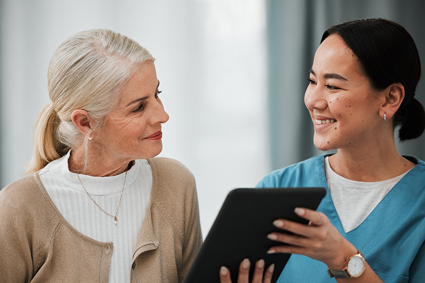 Asian woman nurse, elderly patient and tablet