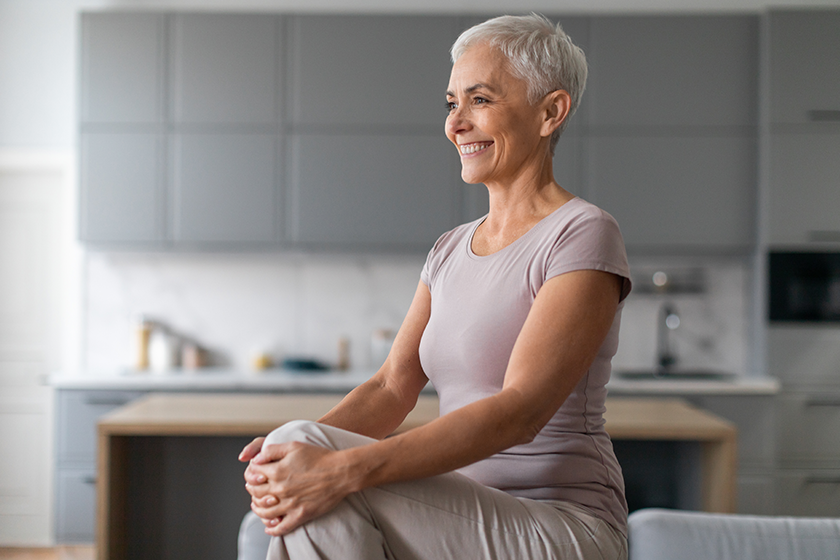 Cardio Workout. Cheerful Mature Woman Doing High Knee exercise