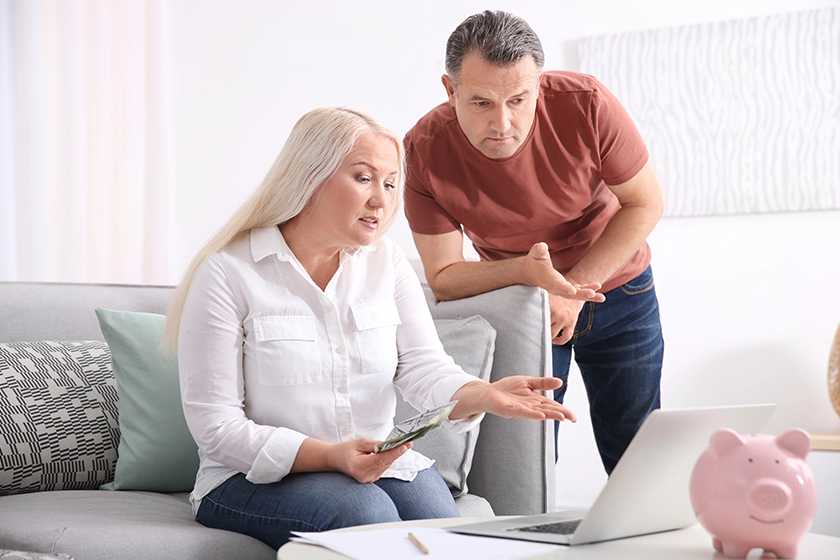 Mature couple managing family budget