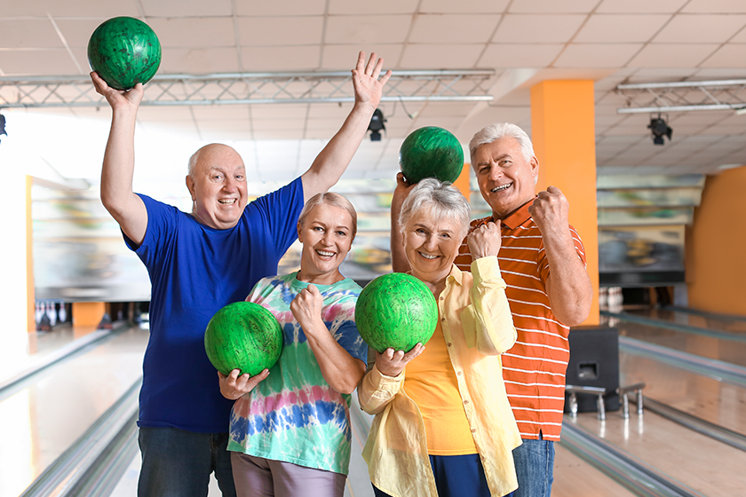 Portrait of senior people in bowling club 